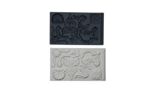 An image of the IOD Classic Elements Mould and the mirror image of the castings resulting from that mould directly below it.